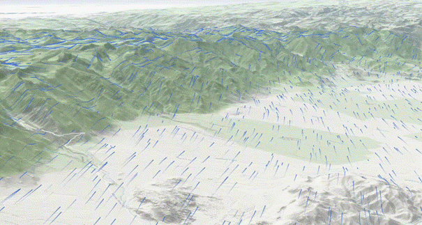 Animierte Strömungslinien über 3D-Gelände im Scene Viewer, die die Windbewegung über Täler und Hänge zeigen